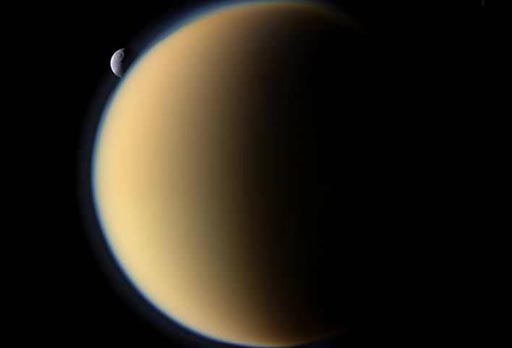This is an image of Titan with Mimas in the background.