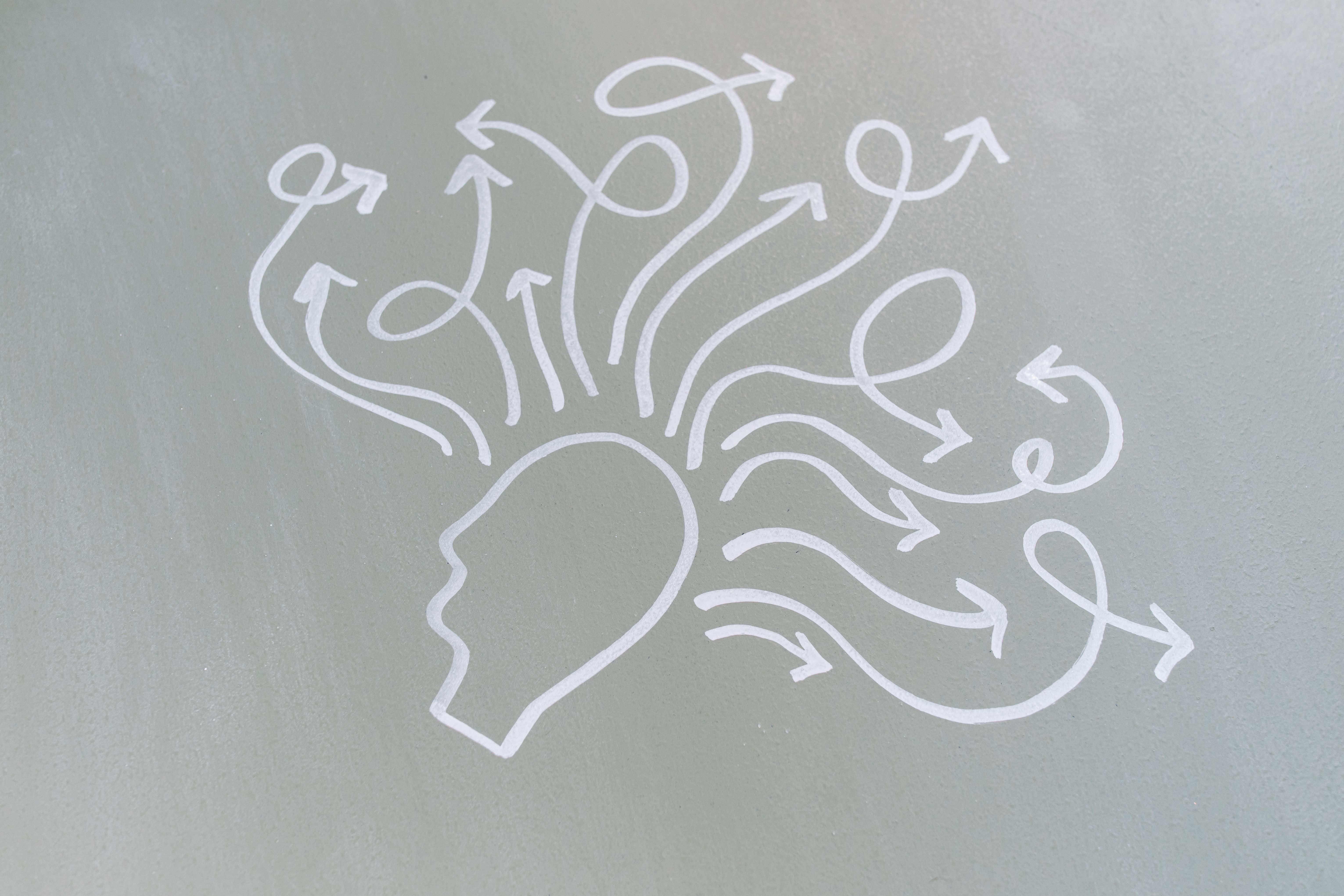 line drawing of arrows leaving a head