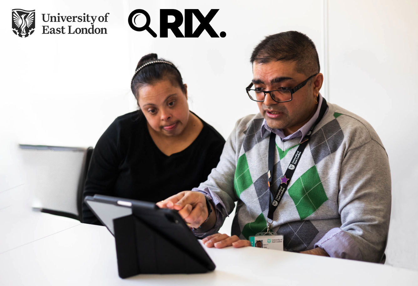 Rix Inclusive Research at the University of East London Logo. Man and woman with a Dawn syndrome work on an iPad together. 