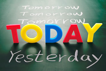 The words ‘Tomorrow’, ‘Today’ and ‘Yesterday’ on a blackboard