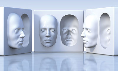 Photo of three sculpture blocks showing the front half of a face sticking out and then in recess in each block illustrating perspective