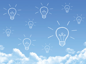 Photo of a blue sky and white clouds with 9 cartoon light bulbs in the sky