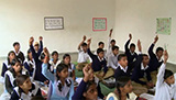 Students being encouraged to contribute to the lesson by raising their hands