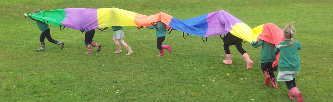 Children Playing with a parachute at a play nurture group.