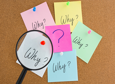 Why? written on stick notes displayed on a noticeboard