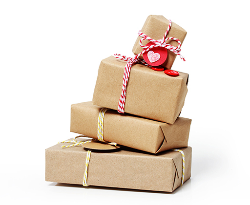 Four brown paper parcels wrapped up in string