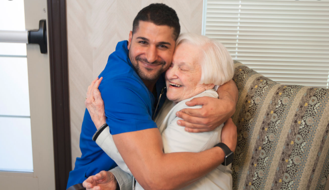 Nurse Hugging Elderly Client