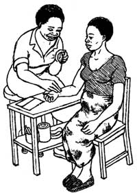 A woman sitting in a relaxed position while a HEP measures her pulse rate