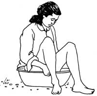 Woman sitting in a cool bath