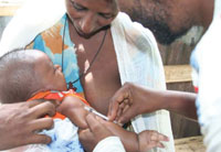 A child being given a vaccination.