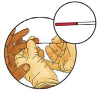 Blood being drawn from the finger using a capillary tube.
