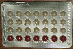 Combined oral contraceptive with spacer pills in bottom row.