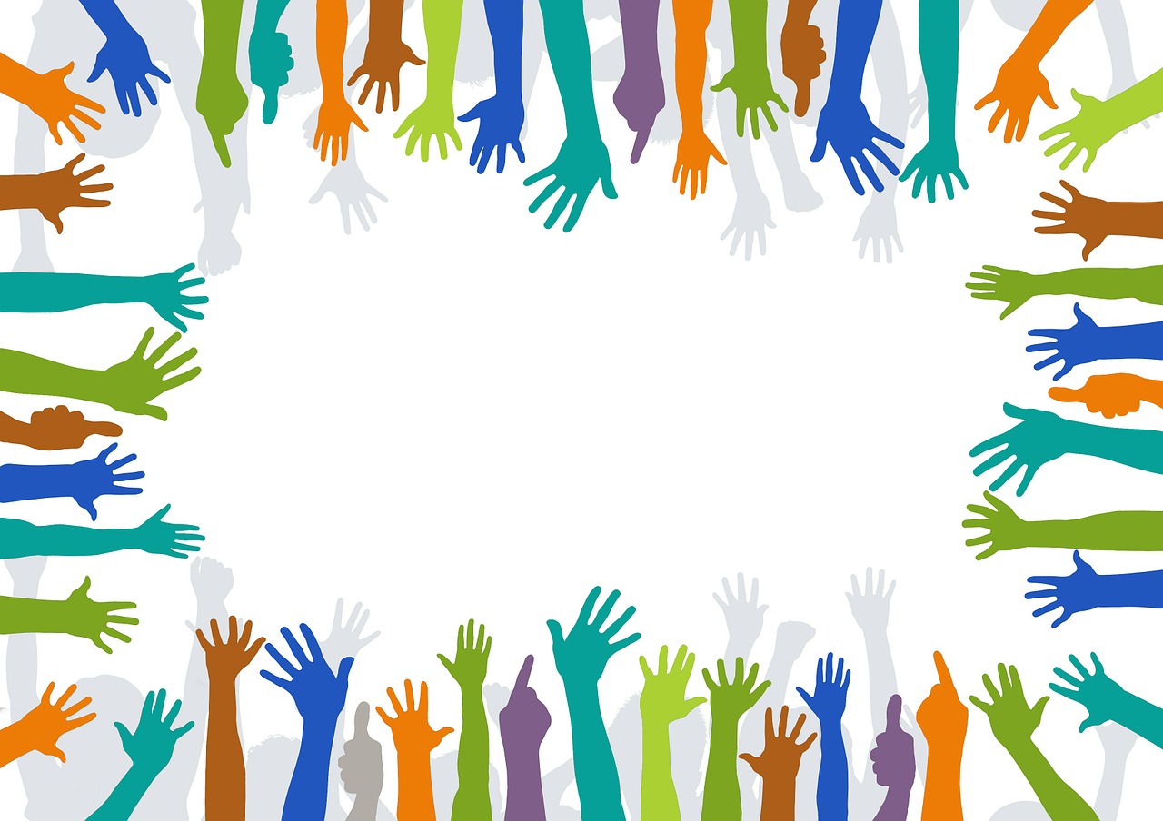 Diverse hands reaching out to help
