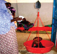 A child being weighed.