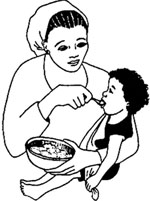 A woman feeding her child.