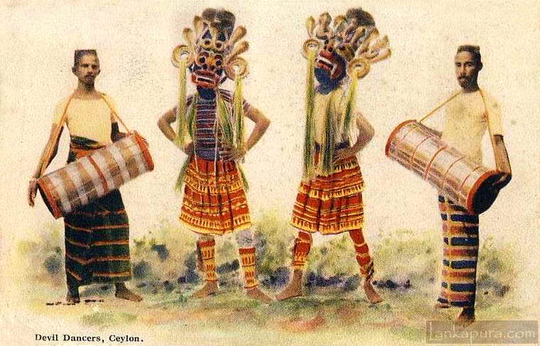 Devil masked dancers accompanied by Thovil drummers