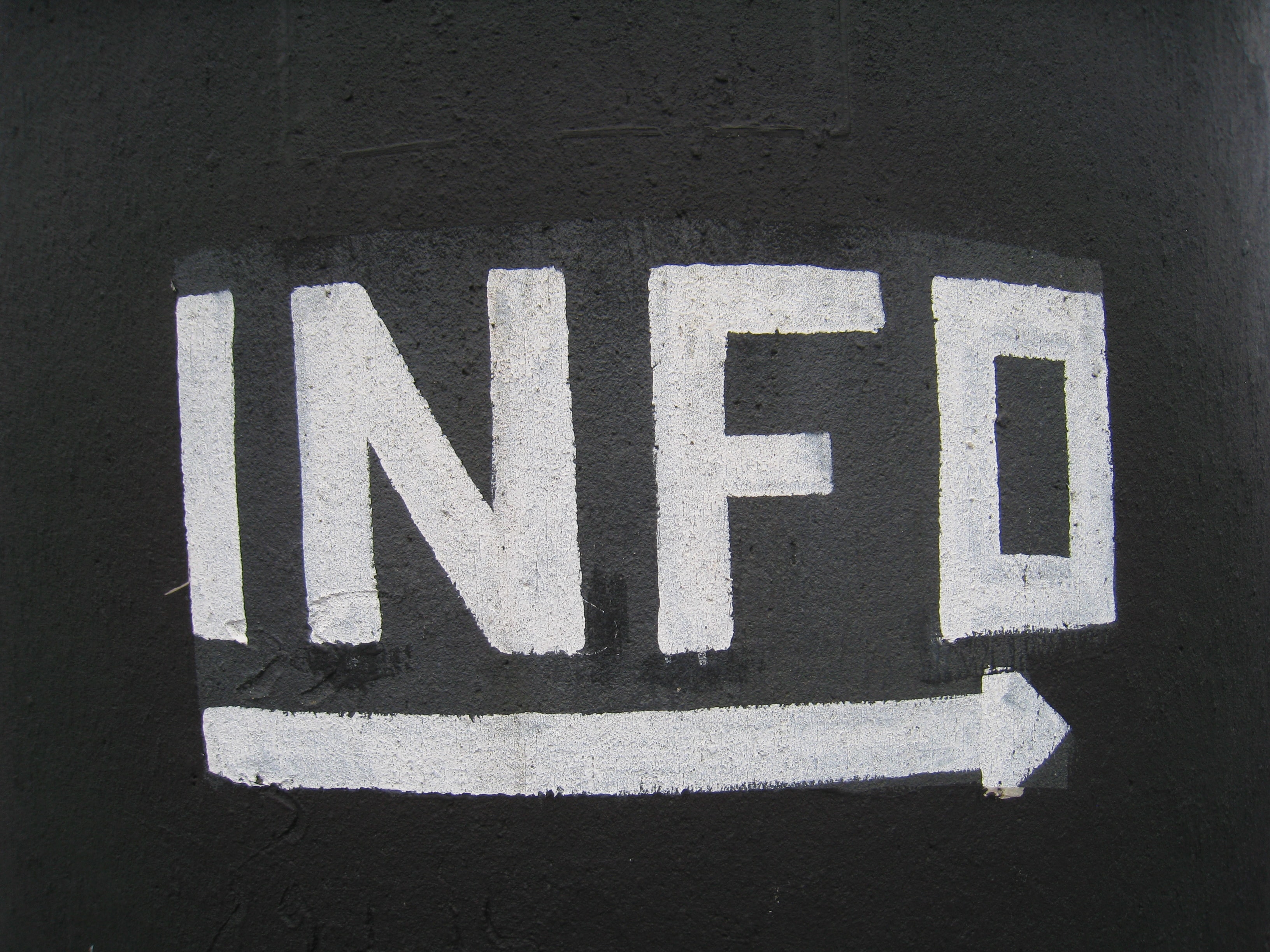 Sign saying Info with an arrow pointing right
