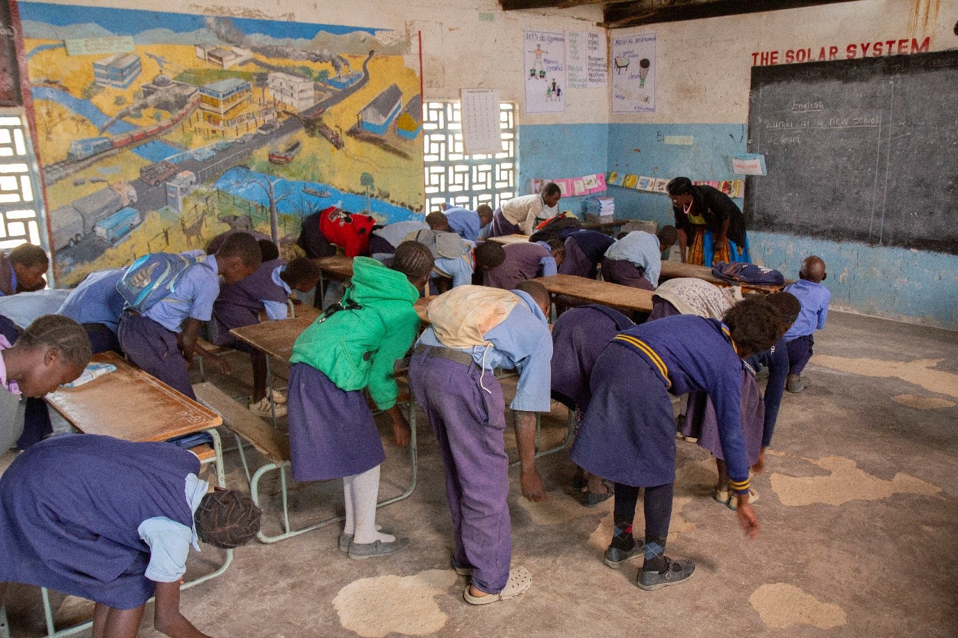 Teachers and Learners participating in a game/song to support learning