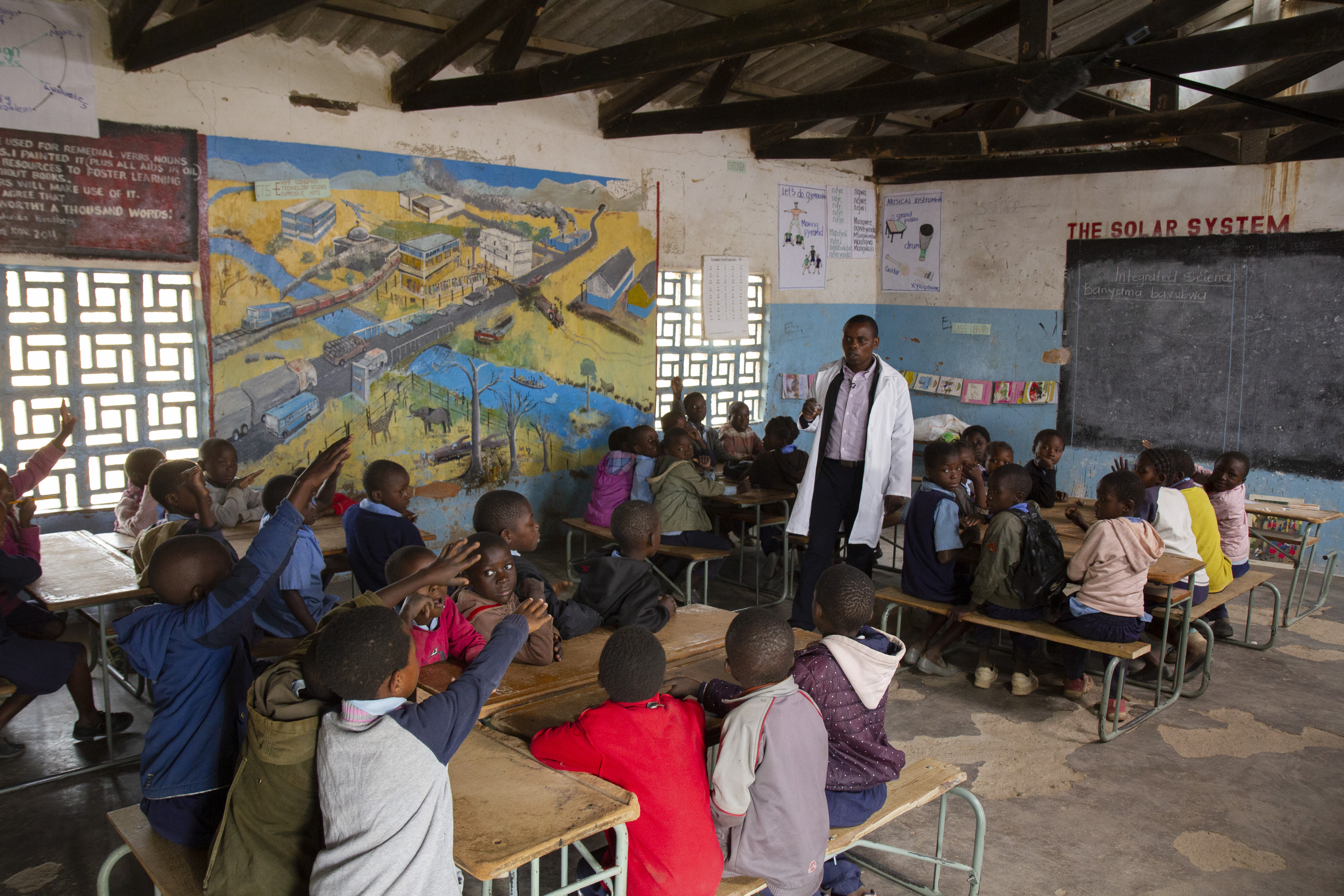 Figure 1: Teacher assessing learning