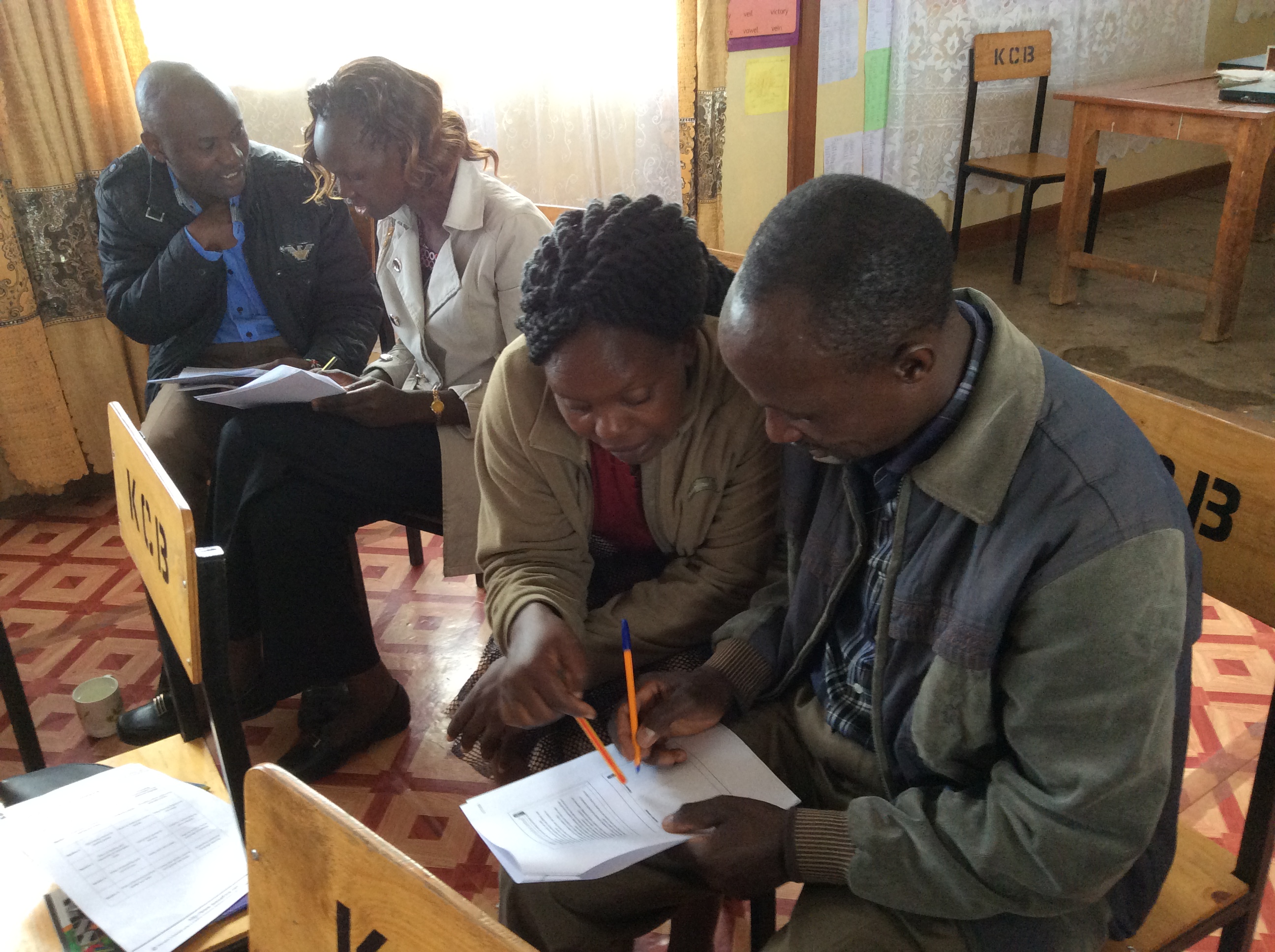 Teachers in Kenya working together during school-based teacher development