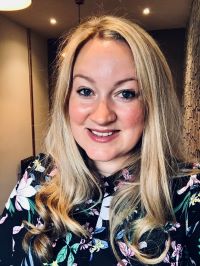 A head and shoulders photograph of Claudine McFaul.