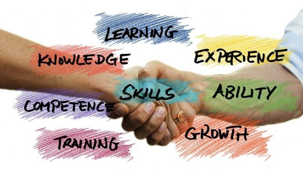 Image depicting handshake of two persons framed by phrases reflecting elements of agreement