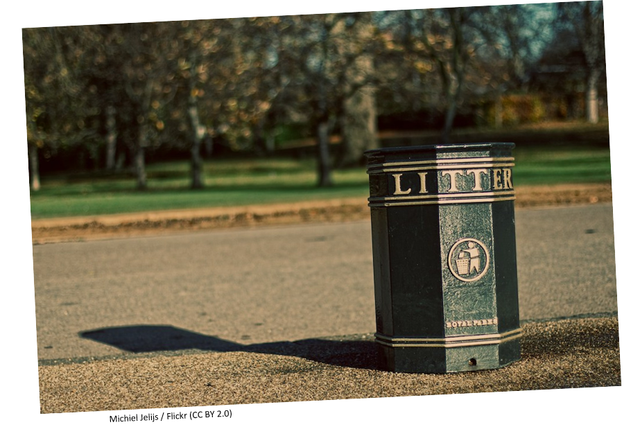 A litter bin in a park.
