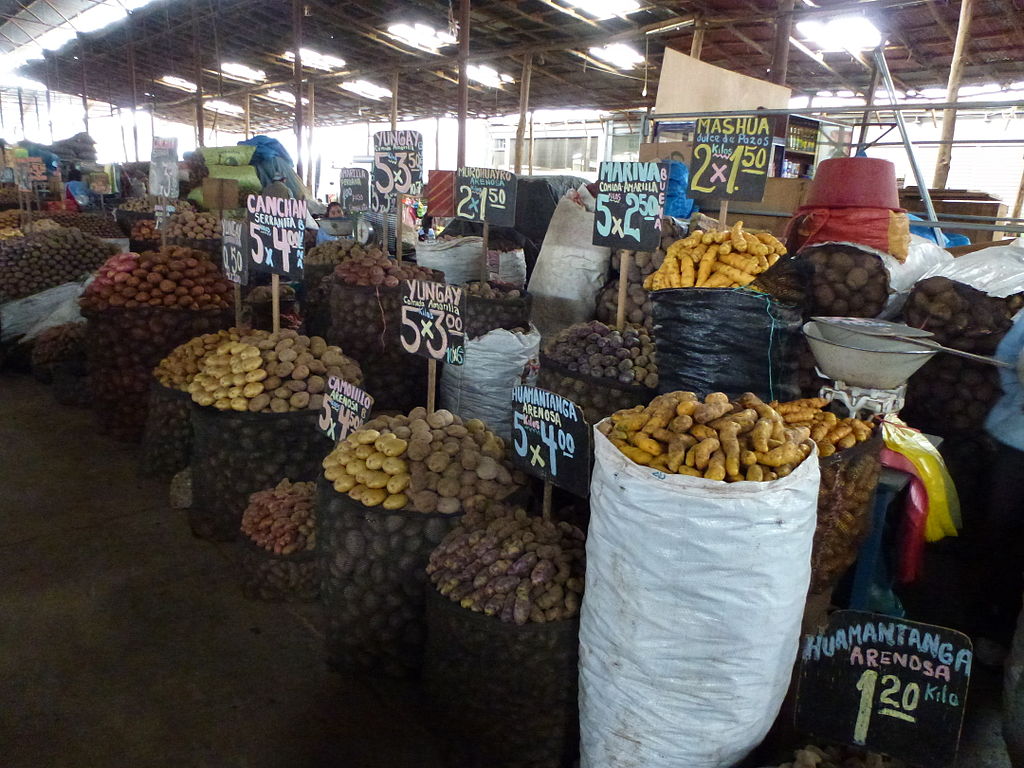 Sacks of potatoes set out in a market