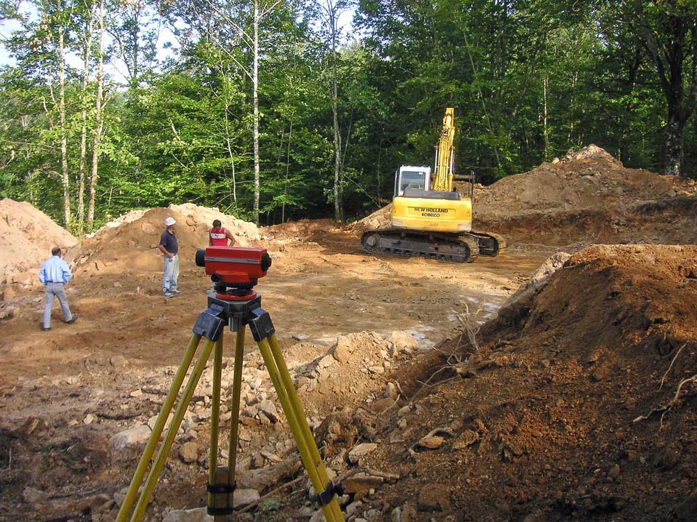 A theodolite set up on a building site.