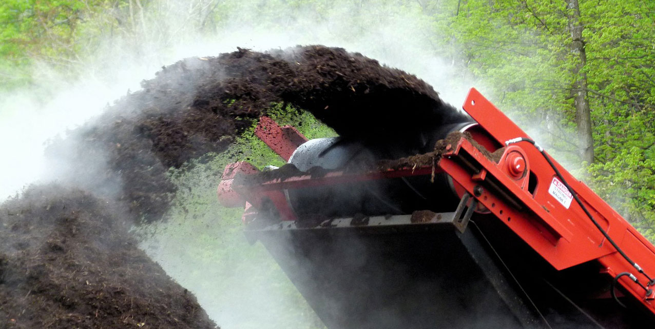 A machine grinding chippings to create compost.
