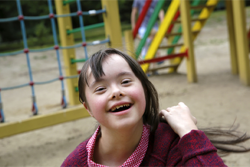 This is a photograph of a child in a playground.