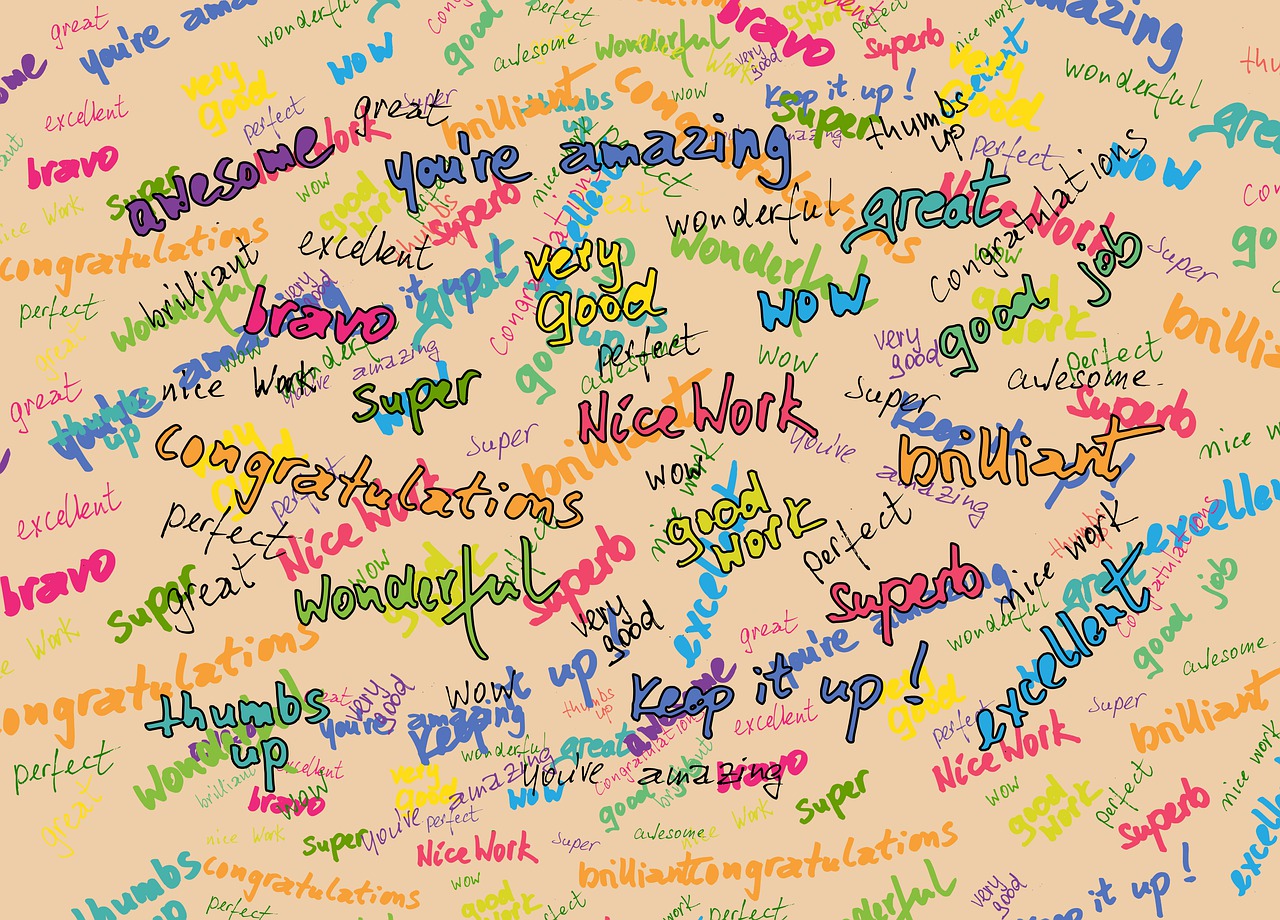Collage of colourful words relating to achievement, including well done, amazing, superb, awesome, keep it up, wonderful.