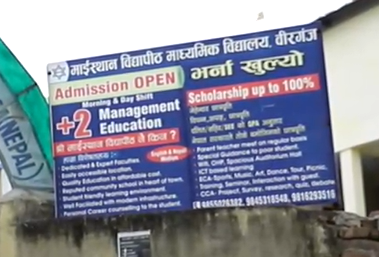 A school sign advertising admissions in English and Nepali