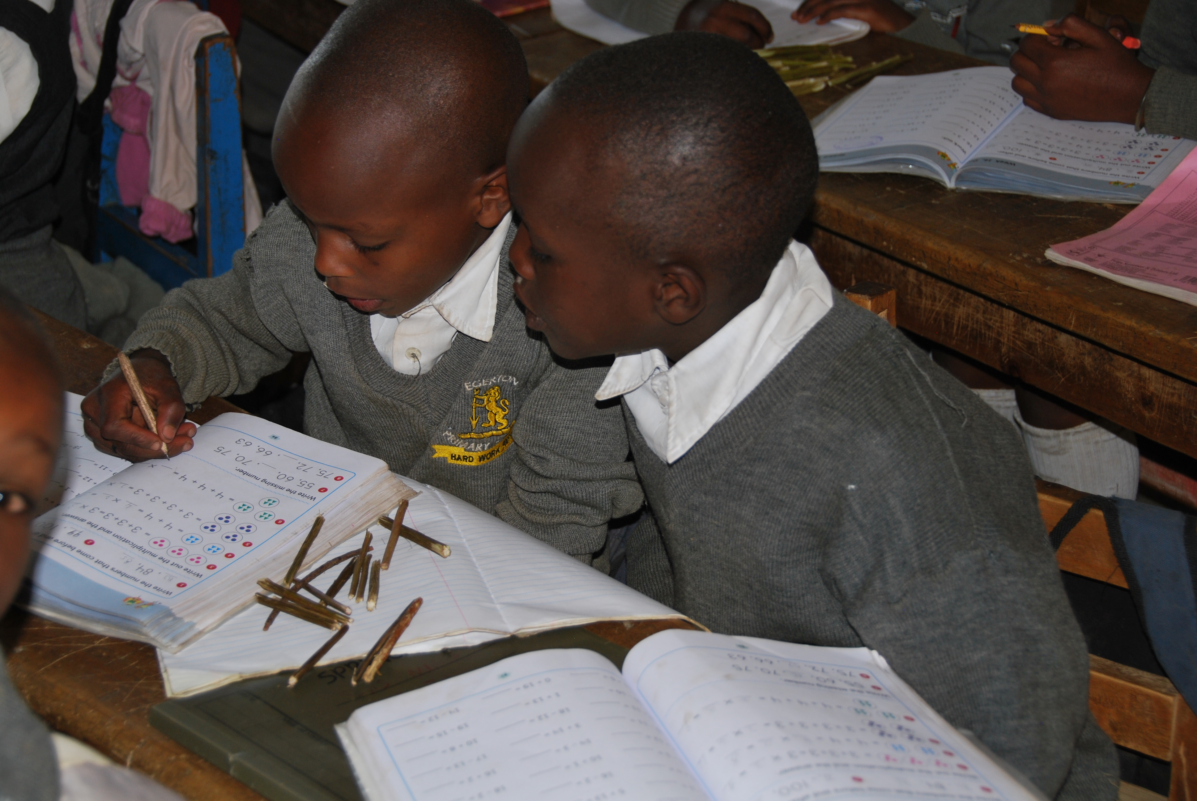 Children in groups playing games.