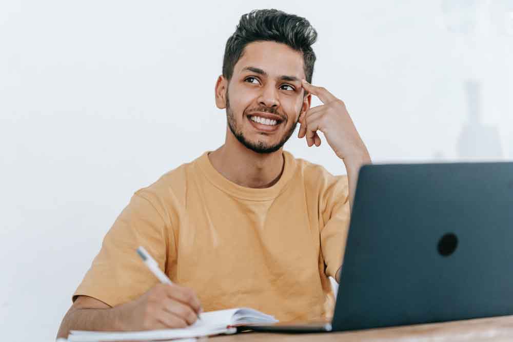 Man using laptop smiling