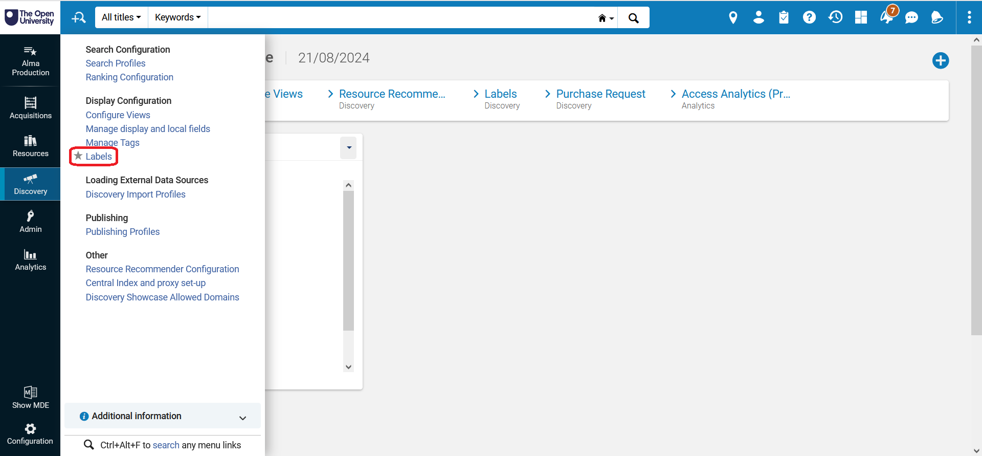 A screenshot of Alma with the 'Discovery' menu open and the 'Labels' link circled in red