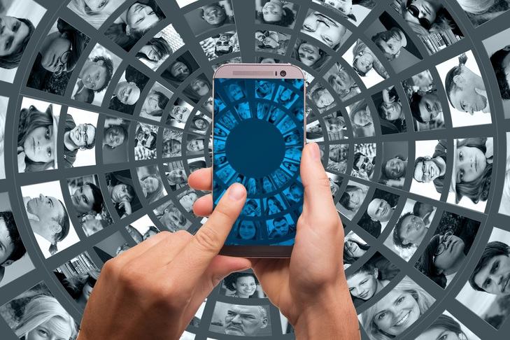 A composite graphic showing concentric rings of faces on computer screens, with a phone screen superimposed showing the same.