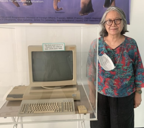 Prof. Kanchana Kanchanasut standing next to the first email server in Thailand