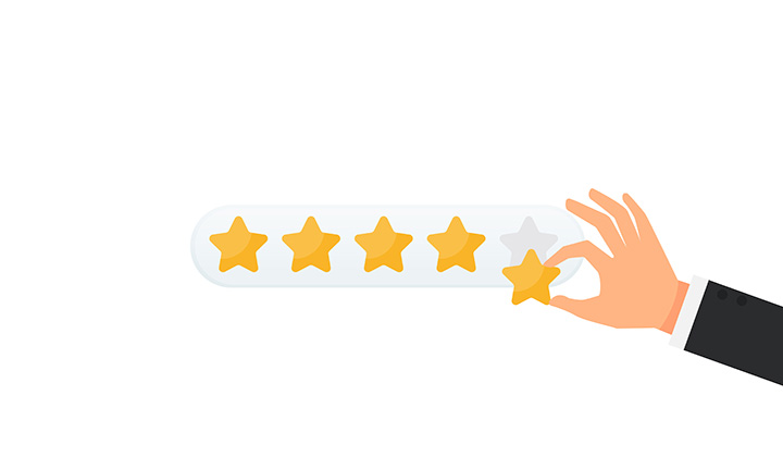 A hand adding a fifth rating star to four existing stars.