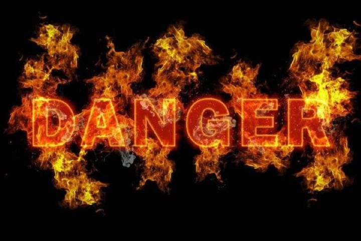 The word. Danger. Imposed on a background of flames.