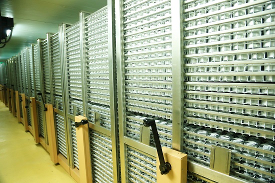 The image shows the storage racks in the base collection of the International Rice Research Institute genebank.