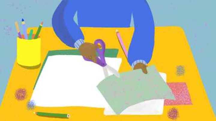 A child working at a school desk.