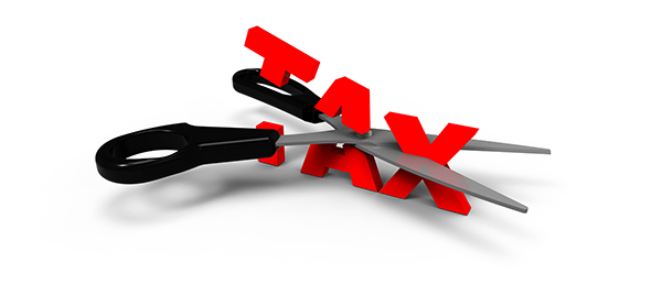 Scissors cutting through the word tax.