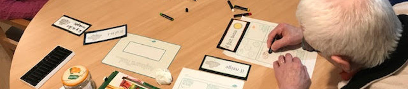 older man filling out worksheet