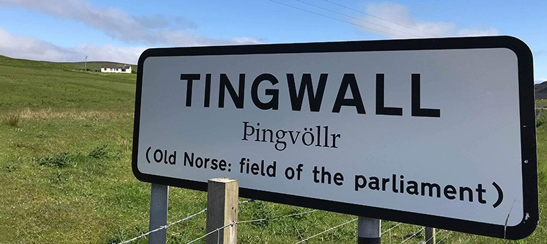 Road sign to Tingwall, with fields in the backgorund