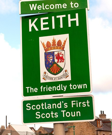 Road sign at entrance to Keith "Welcome to Keith, Scotland's First Scots Toun"