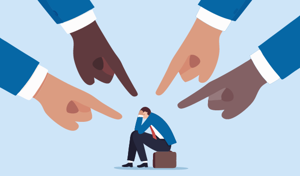 An illustration showing a person sitting on a small suitcase with their head resting on one hand, surrounded by four large hands pointing toward them from different directions.
