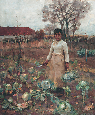 Girl standing in veg patch, holding knife and cut cauliflower.