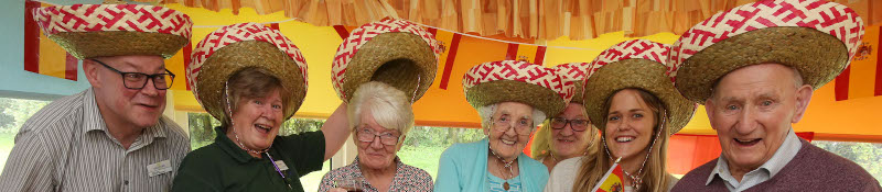 group of older learners with sombreros