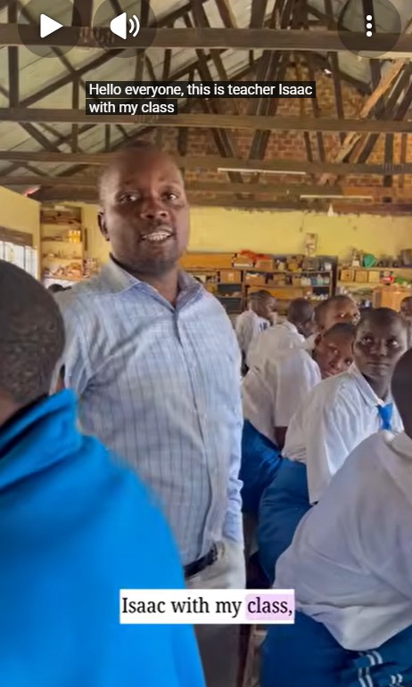Teacher Isaac using locally available materials